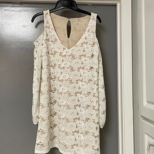 White dress with cold shoulder sleeves.